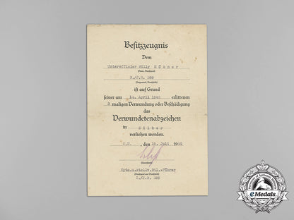 germany,_heer._a_gold_grade_wound_badge_document_group,_leningrad_combatant_aa_8495