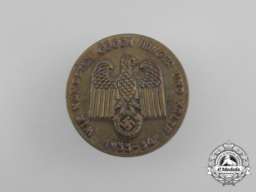 a_third_reich_period_whw“_we_are_fighting_against_hunger_and_the_cold”_donation_badge_aa_8844