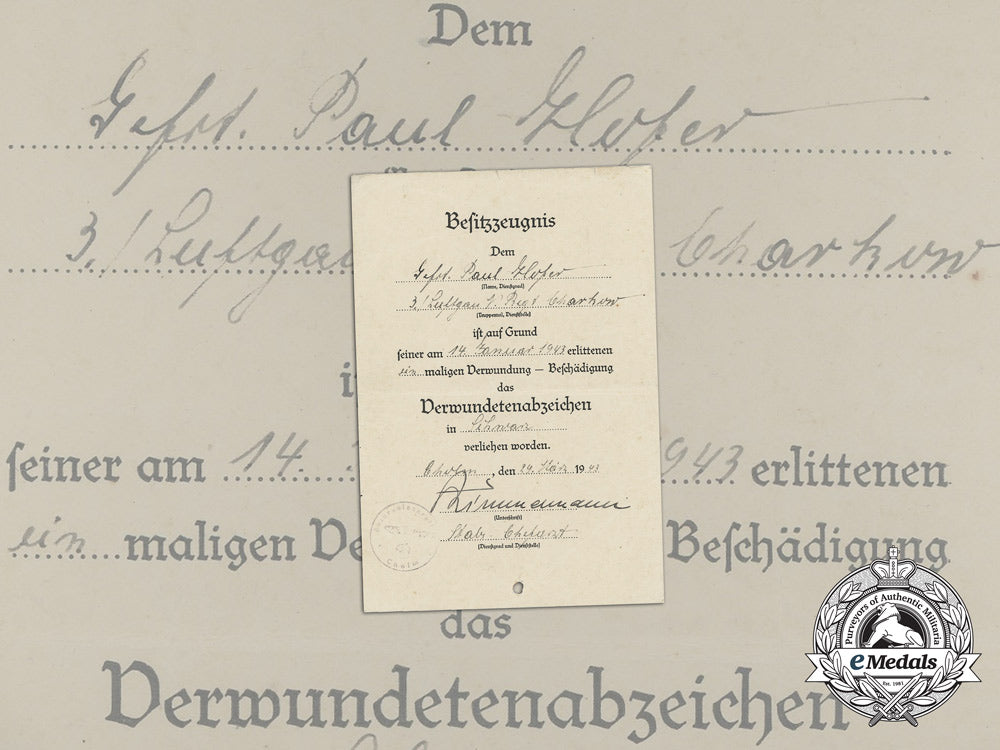 germany,_heer._a_wound_badge_in_black_award_document_to_gefreiter_paul_hofer_in_kholm_aa_9121
