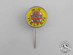 A Third Reich German “We Are Helping Fight Hunger And The Cold” Donation Badge By Paulmann & Crone
