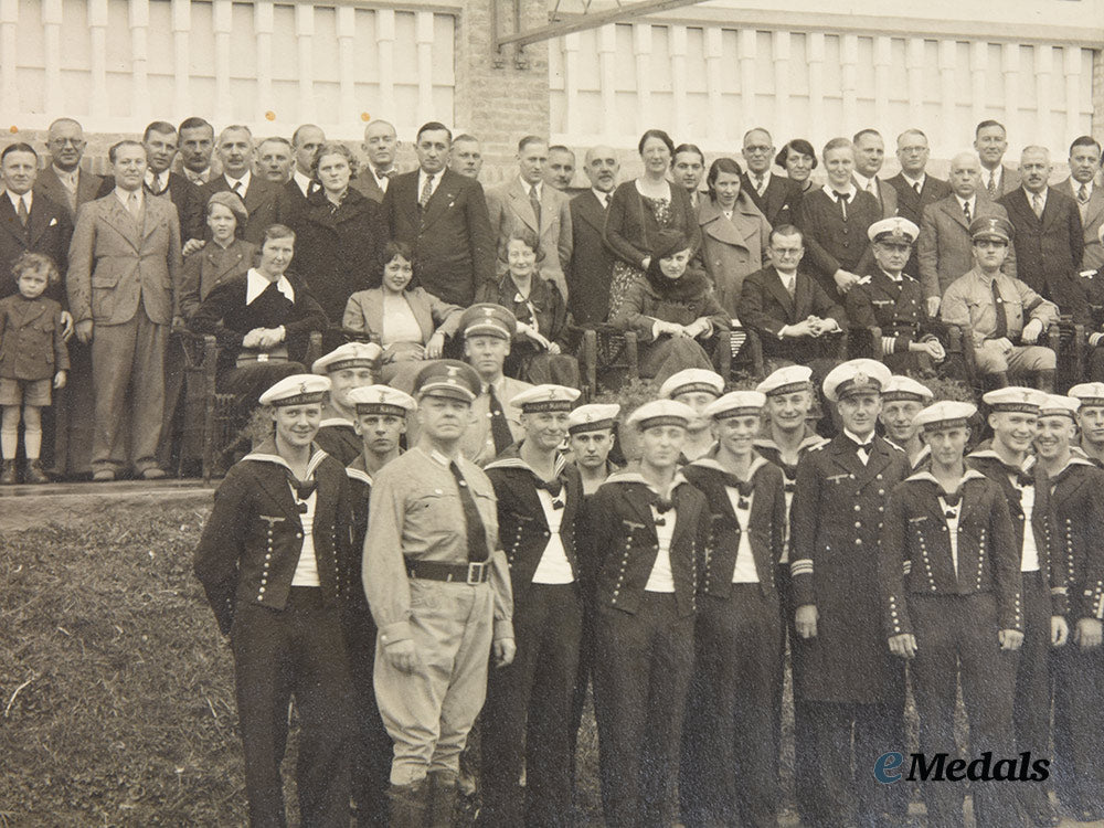 germany,_kriegsmarine._a_large_photo_of_u-_boat_ace_herbert_schultze_with_the_crew_of_the_cruiser_karlsruhe_ai1_2008