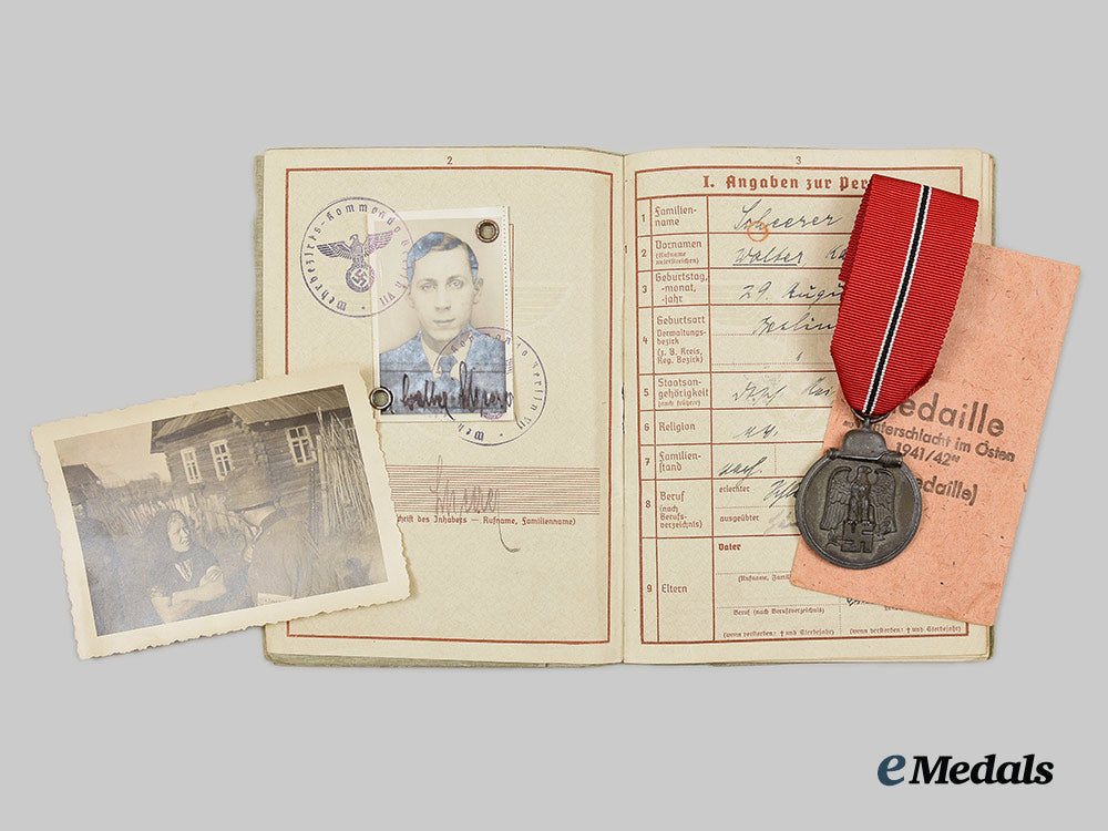 germany,_heer._an_eastern_front_medal_and_wehrpaß_to_obergefreiter_walter_scheerer_ai1_3440