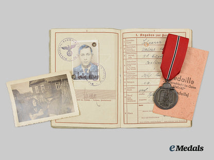 germany,_heer._an_eastern_front_medal_and_wehrpaß_to_obergefreiter_walter_scheerer_ai1_3440