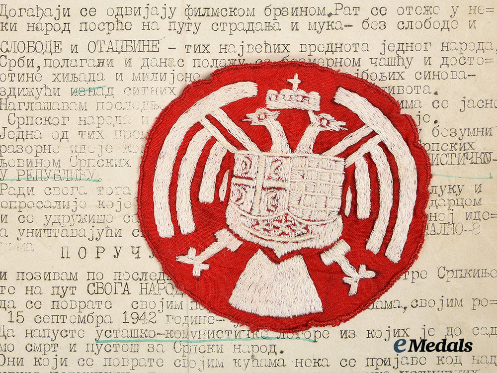 yugoslavia,_kingdom._a_royal_yugoslav_army_insignia,_with_wartime_propaganda_leaflet_ai1_7559