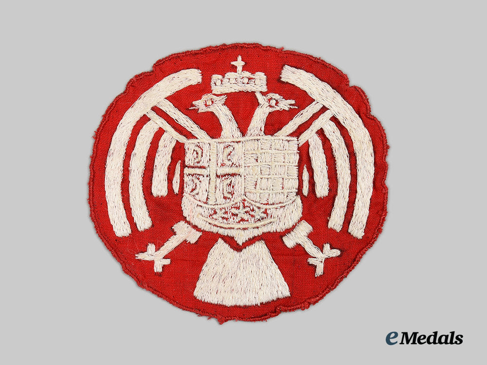 yugoslavia,_kingdom._a_royal_yugoslav_army_insignia,_with_wartime_propaganda_leaflet_ai1_7561