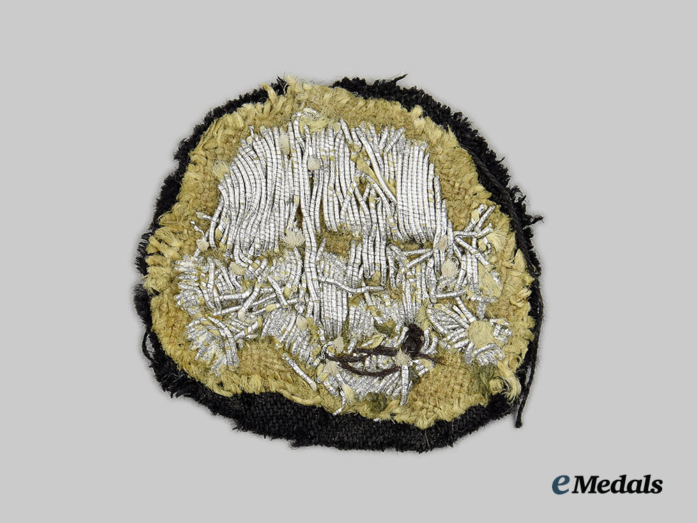 germany,_ss._a_rare_waffen-_ss_officer’s_visor_cap_totenkopf,_collar_tab_cutoff_example_ai1_9322