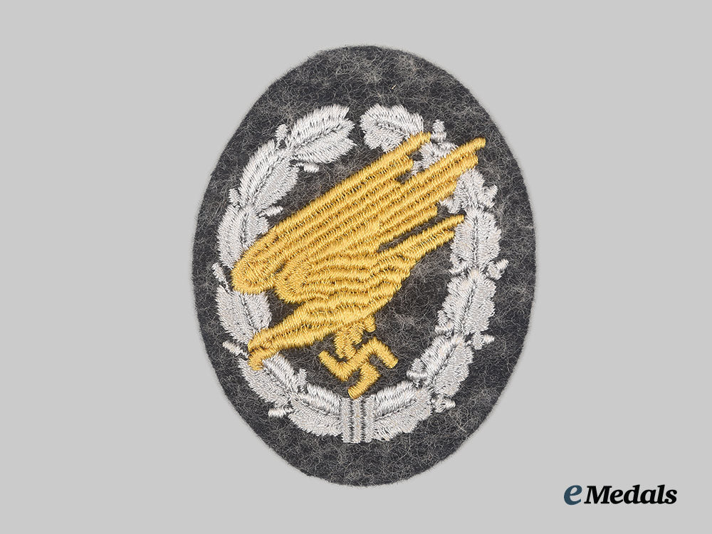 germany,_luftwaffe._a_fallschirmjäger_badge,_cloth_version,_with_promotion_document_to_oberfeldwebel_reichard_hurlebaus_ai23_cbb_7528