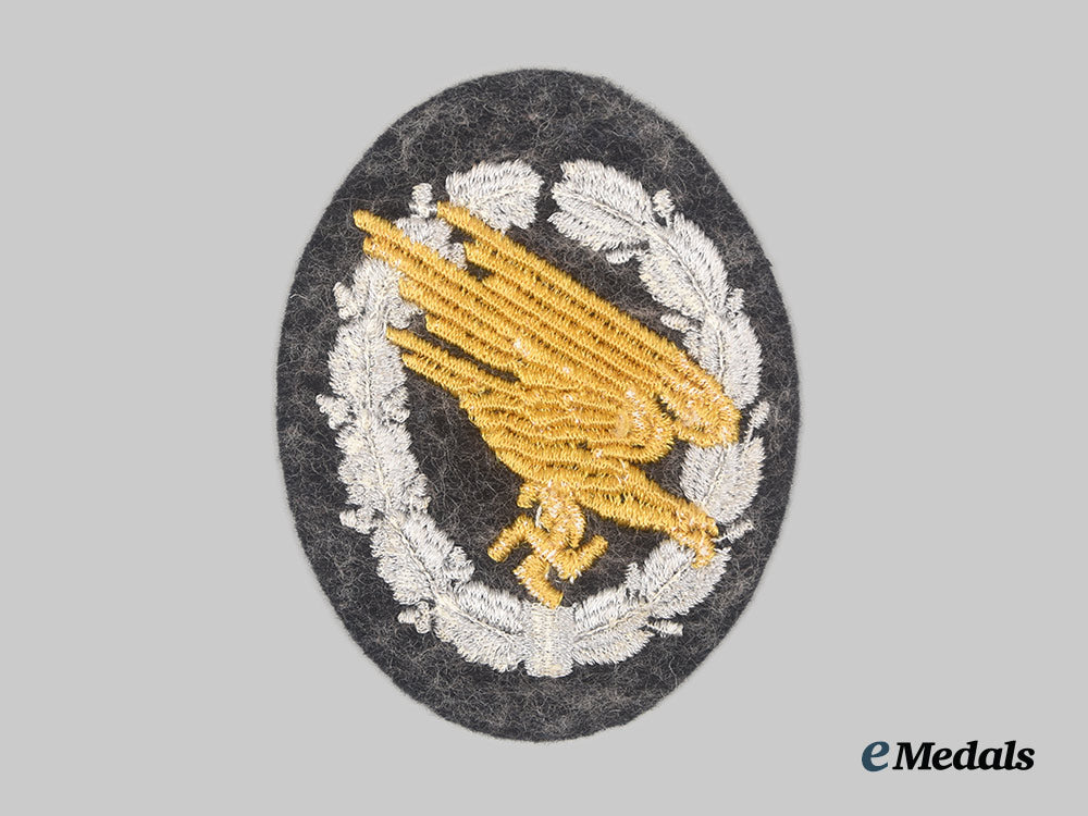 germany,_luftwaffe._a_fallschirmjäger_badge,_cloth_version,_with_promotion_document_to_oberfeldwebel_reichard_hurlebaus_ai23_cbb_7529