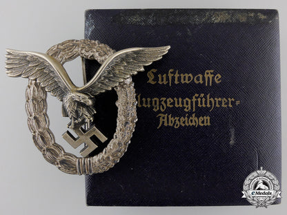 an_early_cased_luftwaffe_pilot's_badge_by_gebrder_wegerhof_an_early_cased_l_55cf5209c39da