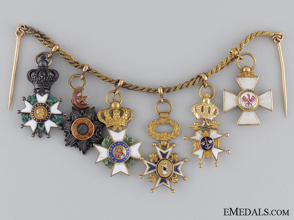 an_early&_attractive_diplomatic_miniature_chain_in_gold_an_early_diploma_53fe2158212d0