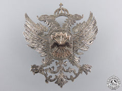 An Early Franco Period Falange Silver Badge