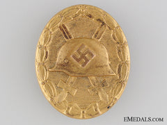 An Early Wound Badge; Gold Grade