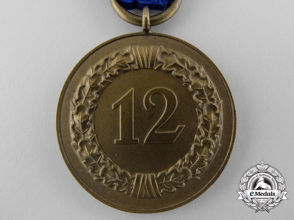 a_wehrmacht_long_service_award;3_rd_class_medal_for_twelve_years'_service_b_3304