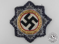 A Luftwaffe Issue German Cross In Gold; Cloth Version