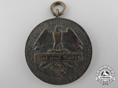 A Second War German Blood And Soil Merit Medal