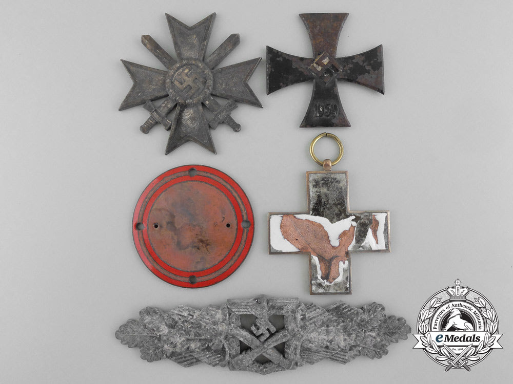 a_lot_of_german_medls,_awards,_and_order_parts_from_the_destroyed_zimmermann_b_9103
