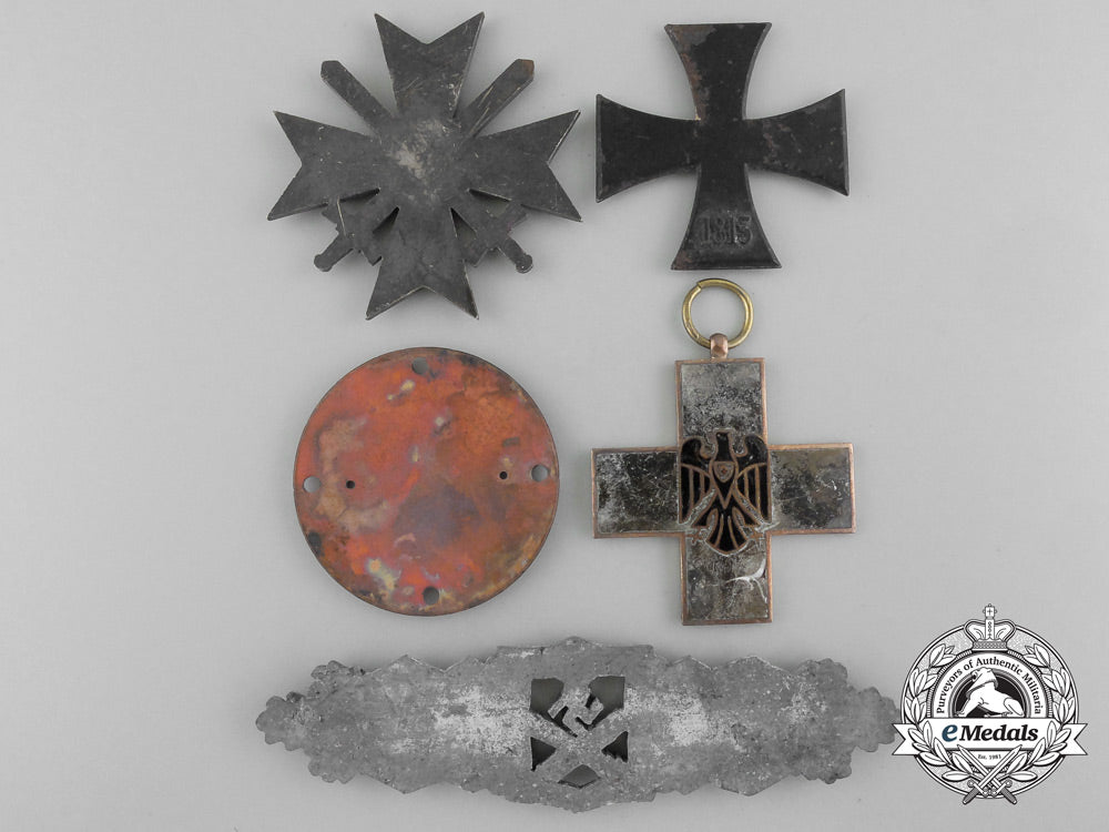 a_lot_of_german_medls,_awards,_and_order_parts_from_the_destroyed_zimmermann_b_9104