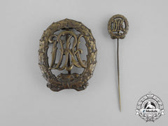A Bronze Grade Drl Sports Badge With Matching Stick Pin By Wernstein Of Jena