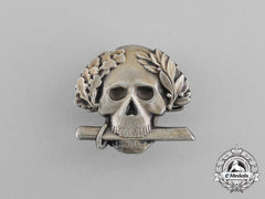 A Second War Italian Black Brigade Skull Badge