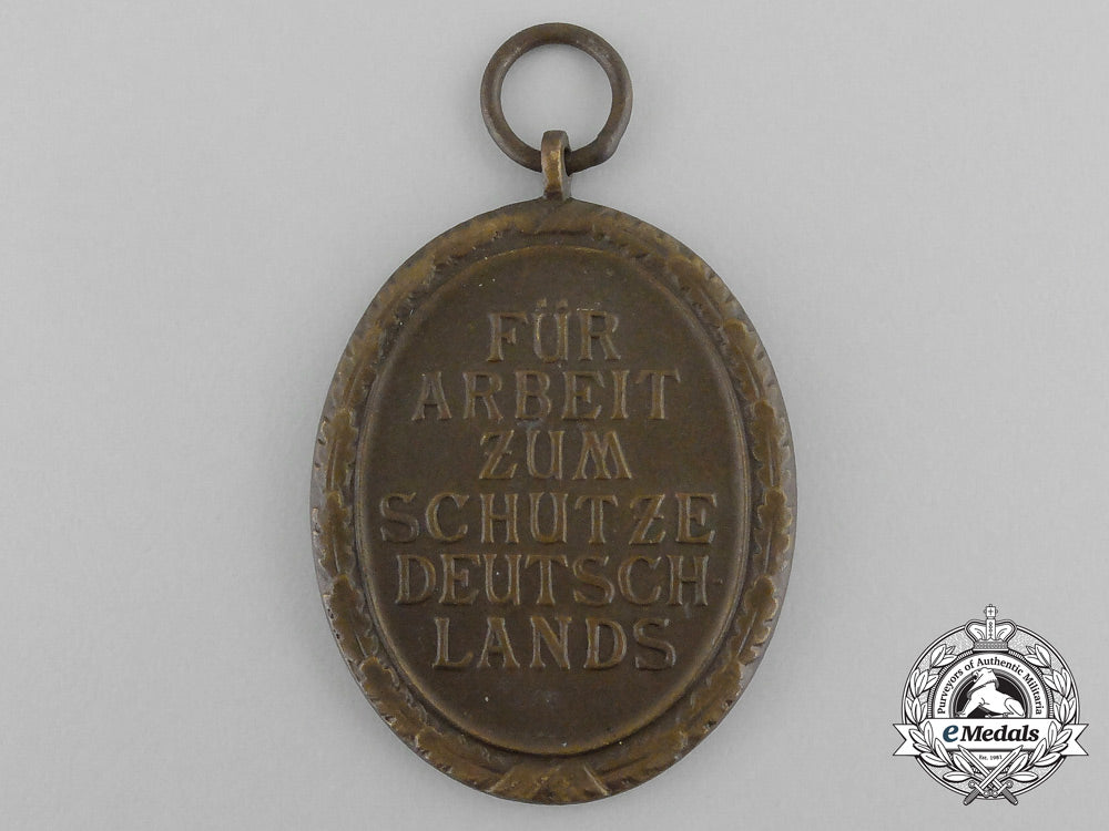 a_third_reich_period_german_defence_wall(_west_wall)_medal_in_its_original_packet_of_issue_bb_2854