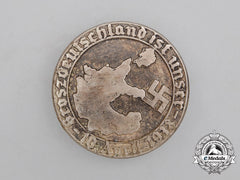 A 1938 “Greater Germany Is Ours” Celebration Badge