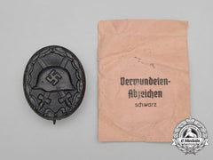 A Black Grade Wound Badge With Packet