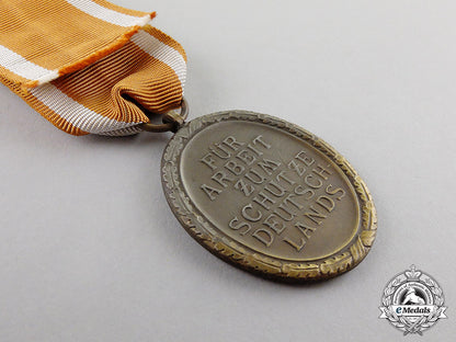 germany._a_west_wall_medal_in_its_packet_of_issue_by_c._poellath_c17-3217