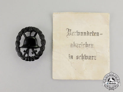 germany._a_mint_imperial_black_grade_wound_badge_in_its_packet_of_issue_c17-5078