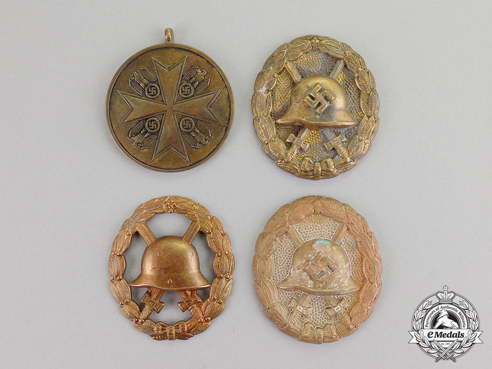 germany._four_zimmermann_recovered_first_and_second_war_badges_and_medals_c17-5683_1