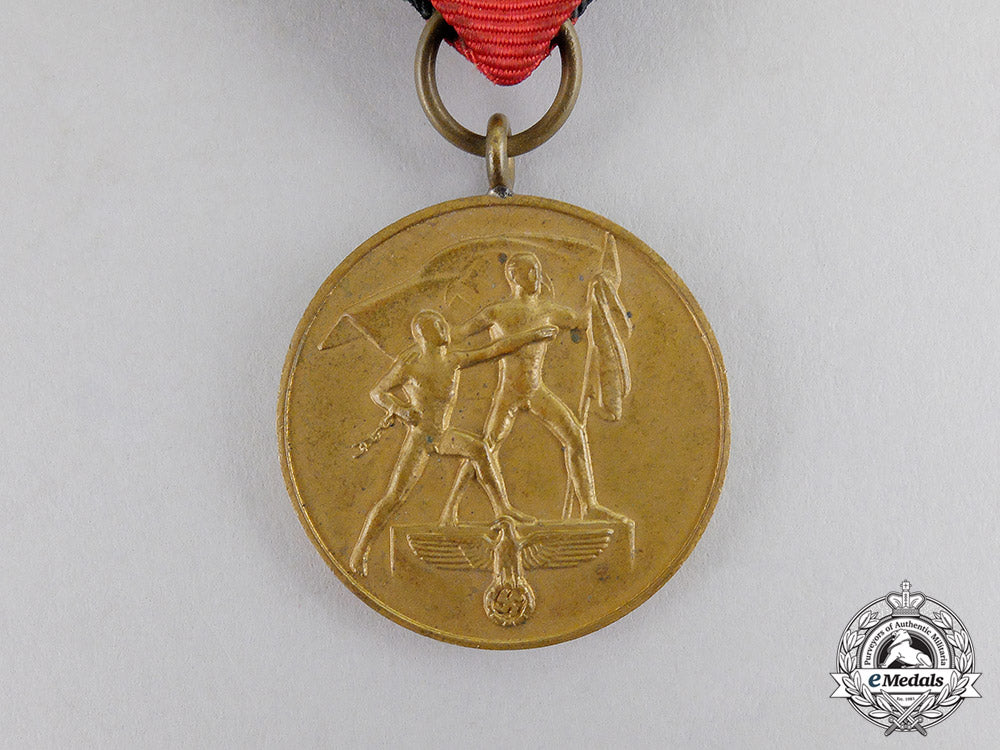 germany._an_entry_into_the_sudetenland_commemorative_medal_with_case_c17-6563