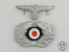 Germany. A Wehrmacht Heer (Army) Visor Cap Insignia Grouping