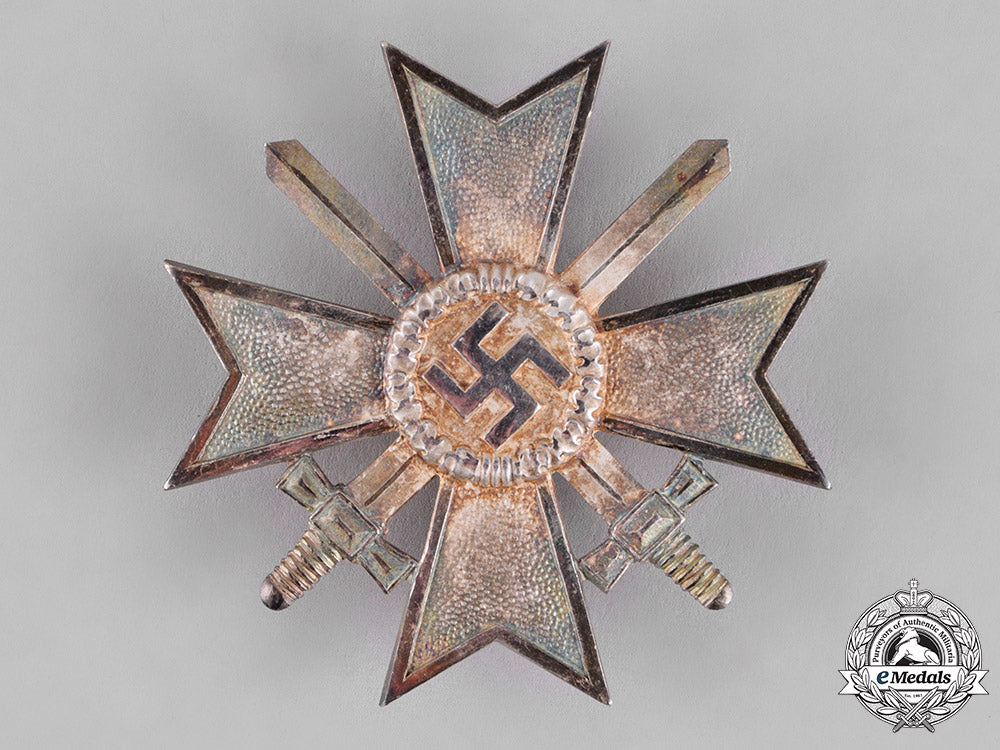 germany,_third_reich._a_mint_war_merit_cross_i_class_with_swords,_by_deschler_c18-013504