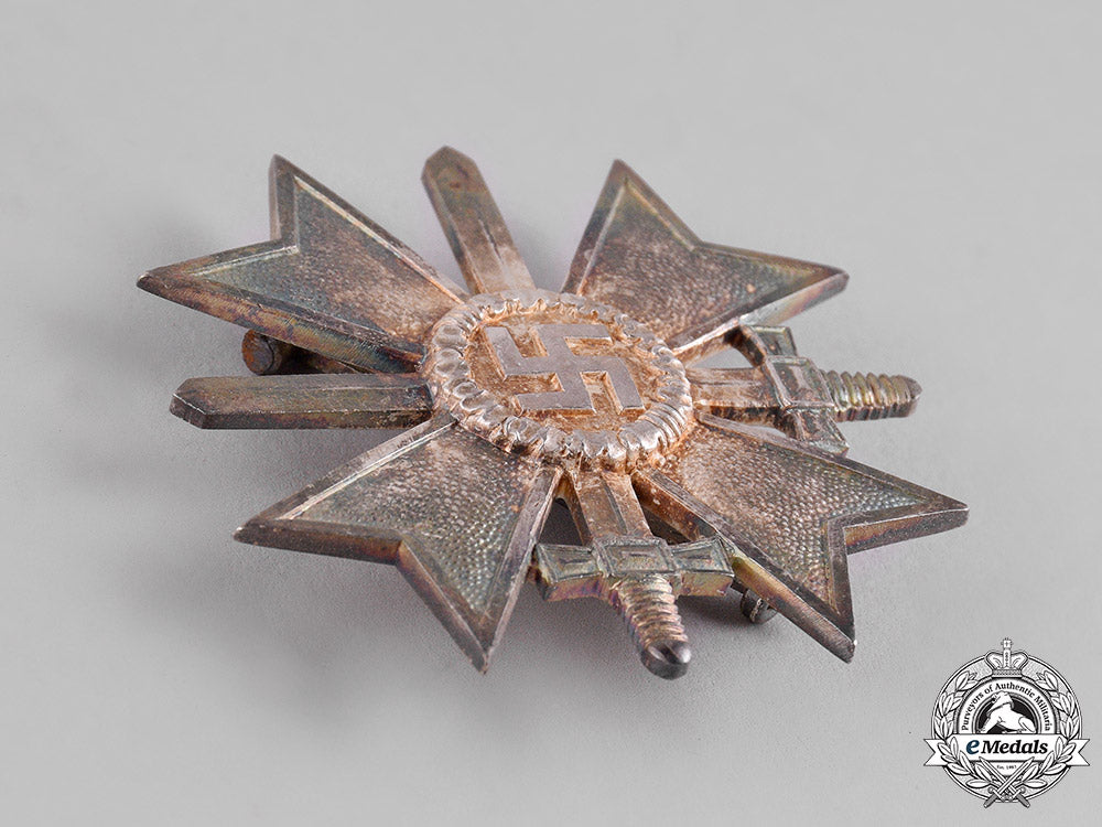 germany,_third_reich._a_mint_war_merit_cross_i_class_with_swords,_by_deschler_c18-013507
