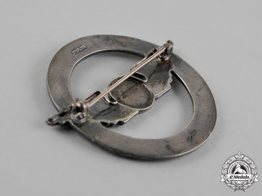 united_states._a_civil_aeronautics_administration(_caa)_war_training_service_cap_badge_c18-018320