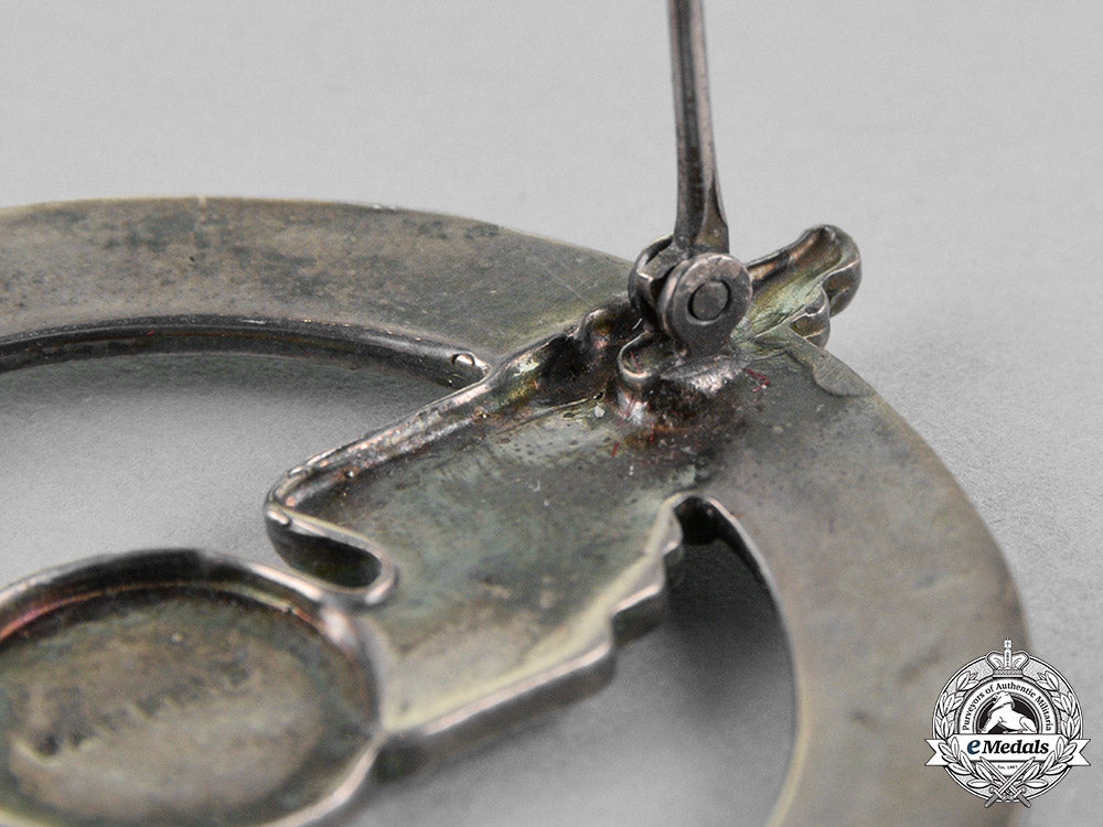 united_states._a_civil_aeronautics_administration(_caa)_war_training_service_cap_badge_c18-018323