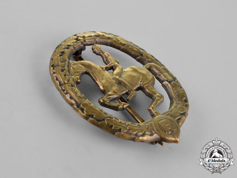 germany._an_equestrian_badge_and_stick_pin,_in_bronze,_by_christian_lauer_c18-019056