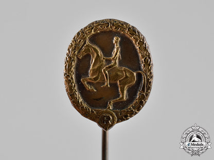 germany._an_equestrian_badge_and_stick_pin,_in_bronze,_by_christian_lauer_c18-019061