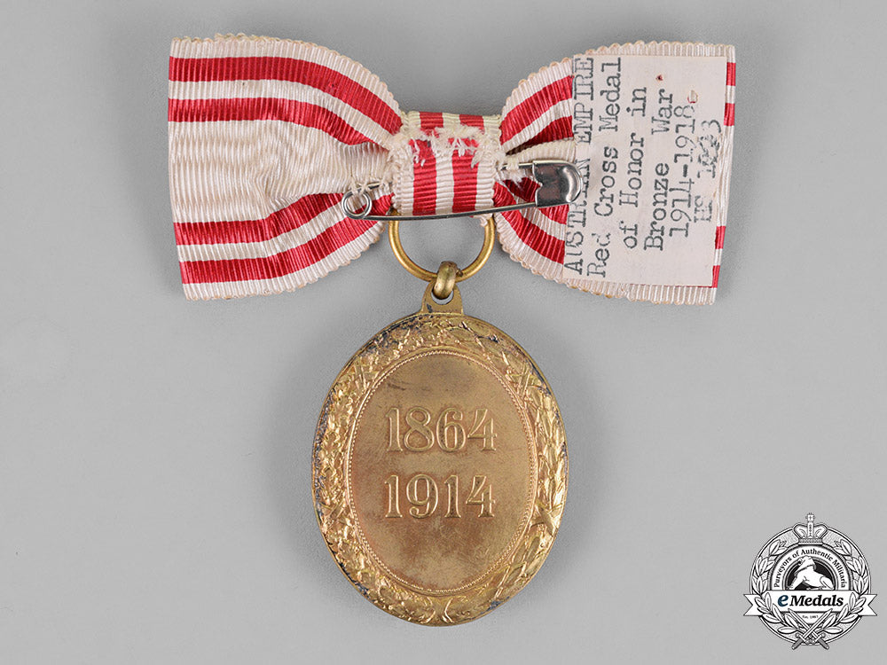 austria,_empire._an_honour_decoration_of_the_red_cross,_bronze_medal_with_w.d,_on_ladies_ribbon_c18-020588_1