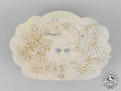 germany,_wehrmacht._an_officer’s_visor_cap_wreath_and_cockade,_bullion_version_c18-020704