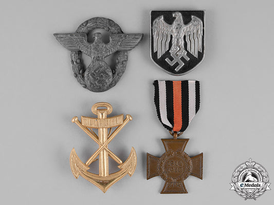 germany._a_grouping_of_four_first_and_second_war_insignia_c18-022921