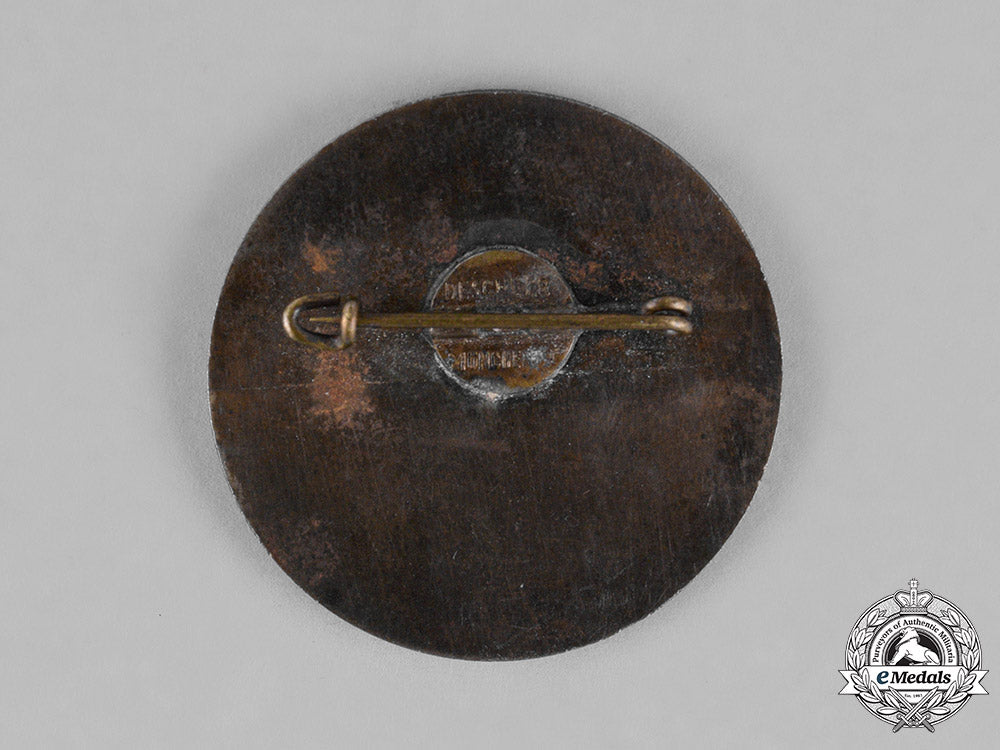 germany._a1934_nsdap_national_party_day_badge,_by_deschler&_sohn_c18-023000