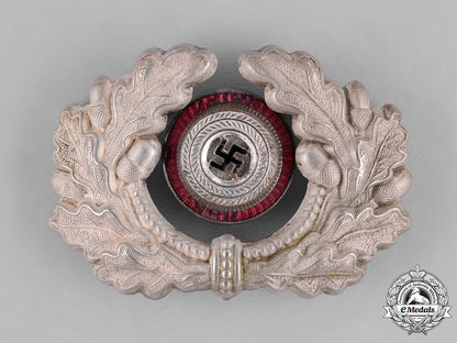 germany,_third_reich._a_grouping_of_third_reich_visor_cap_insignia_c18-034669