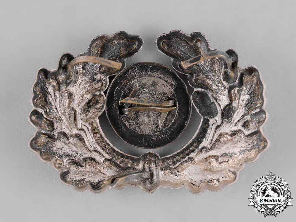 germany,_third_reich._a_grouping_of_third_reich_visor_cap_insignia_c18-034670