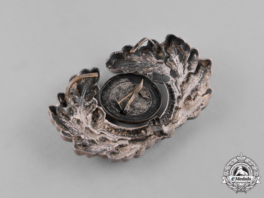 germany,_third_reich._a_grouping_of_third_reich_visor_cap_insignia_c18-034671