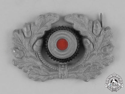 germany,_third_reich._a_grouping_of_third_reich_visor_cap_insignia_c18-034673