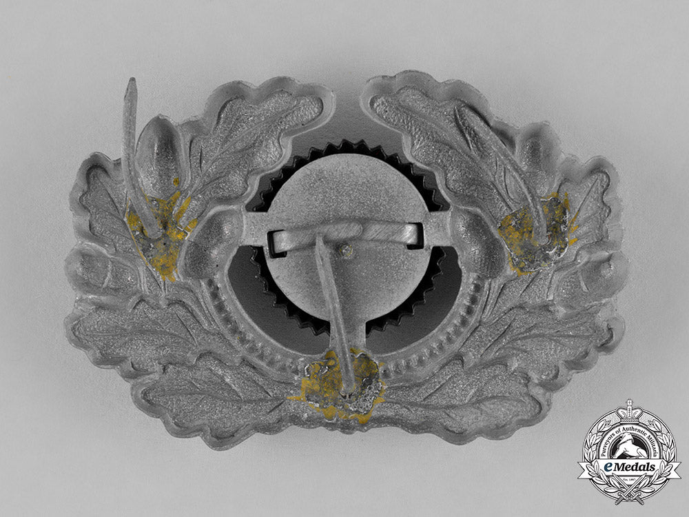 germany,_third_reich._a_grouping_of_third_reich_visor_cap_insignia_c18-034674