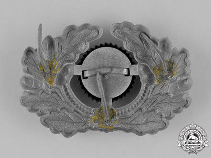 germany,_third_reich._a_grouping_of_third_reich_visor_cap_insignia_c18-034674