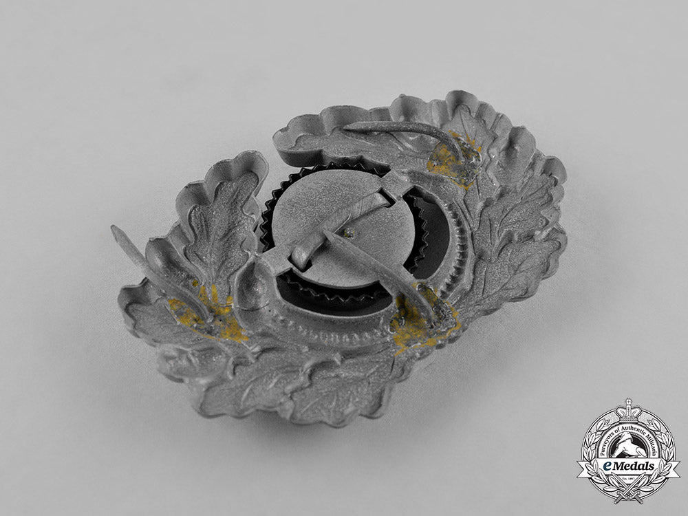 germany,_third_reich._a_grouping_of_third_reich_visor_cap_insignia_c18-034675