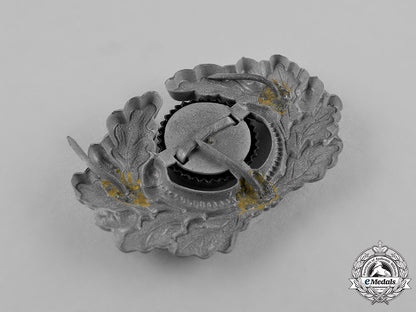germany,_third_reich._a_grouping_of_third_reich_visor_cap_insignia_c18-034675