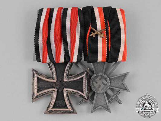 germany,_third_reich._an_iron_cross1939,_ii_class,_and_war_merit_cross_with_swords_medal_bar_c18-036143